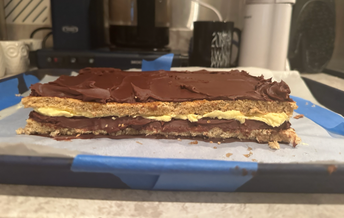 Building the opera cake, with layers of jaconde, ganache, and buttercream.